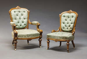 
	
		A pair of Victorian walnut and carved lady's and gentleman's chairs, upholstered in...