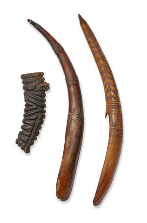 
	
		A rhino horn hilt and two African horn grain scoops, 19th century, the hilt deeply carved...
