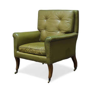 
	
		A Regency library armchair, with square back and curved armrests, upholstered in green...