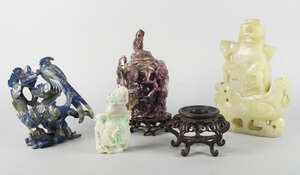 
	
		A Chinese celadon hard stone vase, 20th century, supported on a birds back, with pierced...
