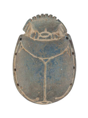 An Egyptian scarab with blue faience inlay, 6.5cm. long   
		 
		Provenance: Collection of George and Dora Mathues, Philadelphia, USA acquired in Egypt in t