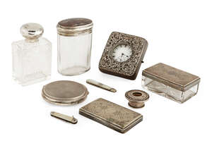 
	
		A silver mounted scent bottle, Birmingham, c.1911, C C May & Sons, of rectangular form...