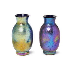 
	
		Loetz, two miniature iridescent dimpled glass vases
		c.1900, one with a partial paper...