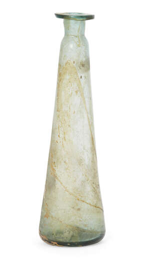 A Medieval pale green unguentarium, with tapering body, thick walled, short, convex lip and horizontal lip, the indented base with pontil mark to underside, in