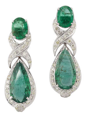 A pair of emerald and diamond pendant earrings, the pear shaped emerald drops with brilliant-cut diamond partial surround, crossover suspension and oval emeral