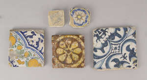 
	
		A square earthenware pottery tile, 18th century or earlier,  decorated with a stylised...