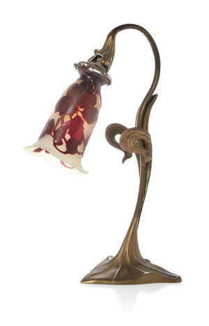 
	
		An Art Nouveau brass table lamp with a Gallé cameo glass light shade
		c.1910, glass...