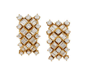 
	
		A pair of diamond earclips,  each designed as a rectangular domed panel set with a...