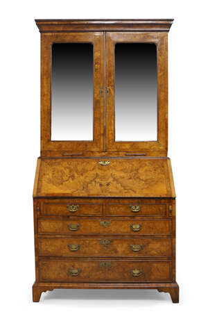 
	
		A George II figured walnut bureau bookcase, the moulded cornice above pair of mirrored...