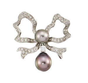 
	
		A cultured pearl and diamond bow brooch, by Meister, the pave diamond ribbon bow with...