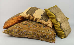 
	
		Ten various size cushions, in gold and bronze silk, most with gilt metal thread appliqué...
