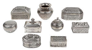 
	
		A group of eight variously decorated silver caskets, India, 19th and 20th century, and a...