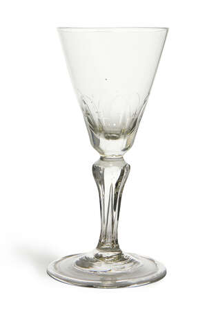 
	
		A George I wine glass, with  inverted conical bowl leading to an inverted lappet and...