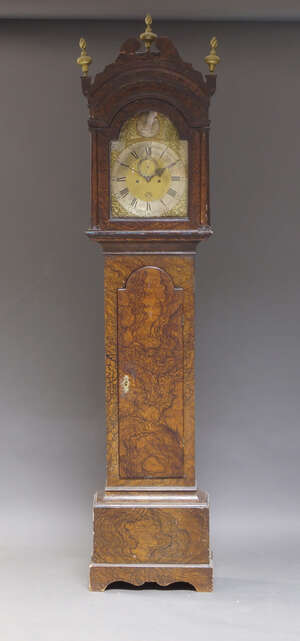 
	
		A George III faux walnut painted longcase clock, by Henry Cooley, the hood with swan neck...