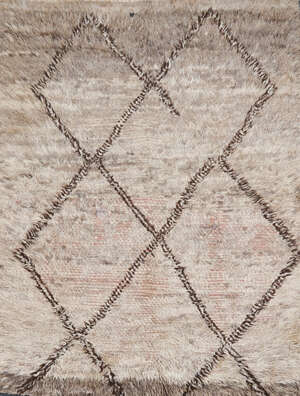 
	
		A Moroccan handwoven long pile wool rug
		Second quarter 20th Century
		Woven with...