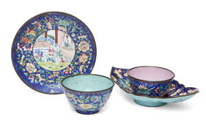 
	
		Two Canton enamel cups and saucers, 19th century, both sets with blue ground, one cup...
