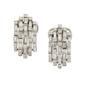 
	
		A pair of diamond cluster ear clips, each domed cluster panel composed of five-rows of...