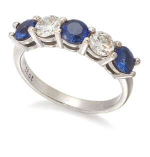 
	
		A sapphire and diamond five stone diamond ring, of half-hoop design, set alternately with...