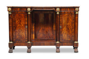 
	
		A Regency mahogany and gilt metal mounted side cabinet, c.1820, possibly Irish, the...