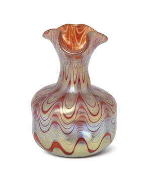 Loetz, a small iridescent glass vase with quatre-foil neck
c.1900
The pink-orange dimpled body...