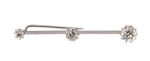 
	
		An early 20th century diamond three stone bar brooch, composed of three graduated...