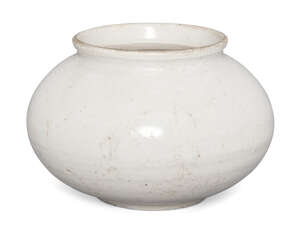 
	
		A Korean jar, Joseon dynasty, 19th century, of compressed globular form and everted rim...
