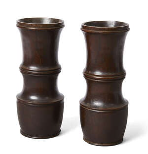 
	
		A pair of English turned lignum vitae mortars, late 17th/early 18th century, each of...