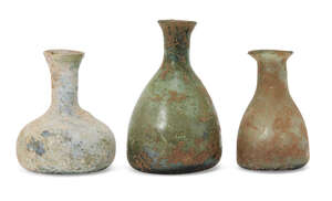 
	
		Three Roman miniature glass vessels, circa 1st-4th century AD, tallest 8.4cm. high...