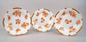 Three Herend  Queen Victorian pattern porcelain plates, in red ochre, with gilt definitions to the rim, 21cm diameter (3)