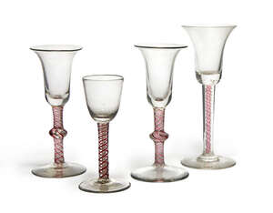 
	
		A wine glass, probably 18th century, with rounded bowl, on a red and wine twist stem, on...