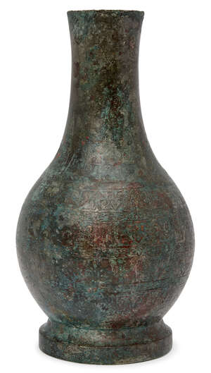 
	
		A Chinese bronze vase, hu, Han dynasty, fine incised to the neck with vertical lappets of...