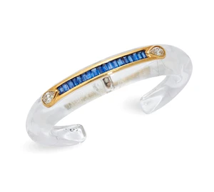 A rock crystal, sapphire and diamond bangle, the carved rock crystal torque bangle with applied...
