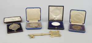 
	
		A group of medallions and presentation items of Jewish interest, comprising a silver-gilt...