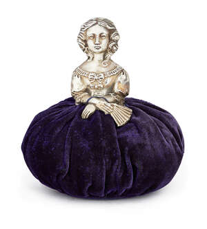 
	
		A silver novelty pin cushion in the form of a lady, Birmingham c.1911, Cornelius...