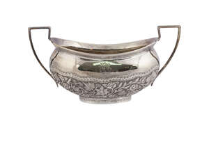 A silver sugar bowl monogrammed 