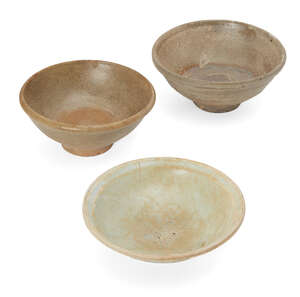
	
		Three Chinese stoneware bowls, Yuan/Ming dynasty, each with an allover glaze of different...
