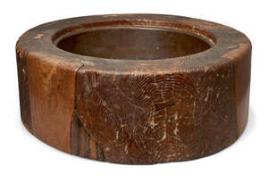 
	
		A Japanese elm hibachi, early 20th century, of typical circular form with copper insert,...
