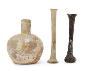 
	
		Three Roman glass vessels, 1st-5th century AD, two unguentarium and a squat clear glass...