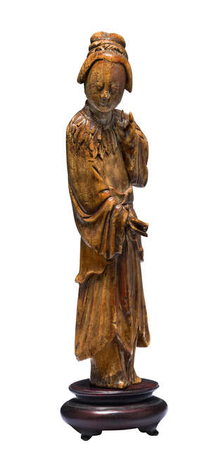 
	
		A Chinese ivory figure, Ming dynasty, carved as a standing woman wearing flowing robes,...