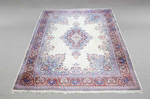 
	
		An Indian carpet, late 20th Century, with medallion in ivory field, red main border,...