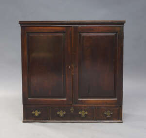 
	
		A George III mahogany side cabinet, the moulded cornice above two panelled doors,...