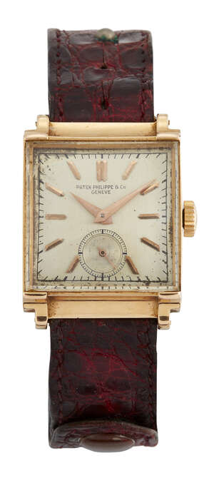 
	
		An 18ct gold wristwatch by Patek Philippe, the square silvered dial with applied gold...