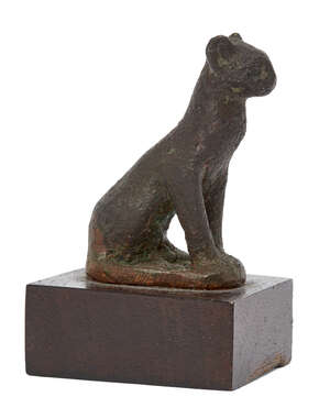 
	
		An Egyptian bronze seated cat
		Late Period-Ptolemaic, 664-30 B.C.
		Depicted seated...
