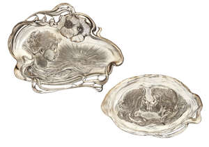 
	
		WMF, two metal visiting card trays with 'antique silver' finish
		c.1906, stamped...