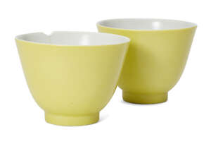 
	
		A pair of Chinese porcelain monochrome cups, Republic period, with lemon glaze to the...