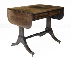 A Regency brass inlaid rosewood sofa table, first quarter 19th century, the drop leaf top above...