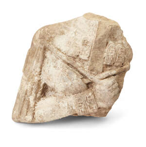 
	
		An Egyptian style sandstone bust of a pharaoh, arms crossed and holding the crook and...