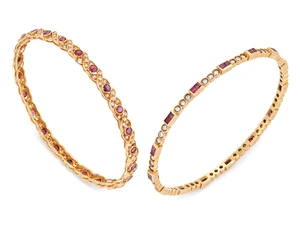 Two ruby and diamond set bangles, the first designed as pairs of channel-set square step-cut...