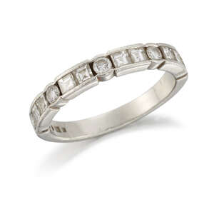 A diamond half-hoop ring, composed of alternate brilliant-cut single stones and square-cut two...