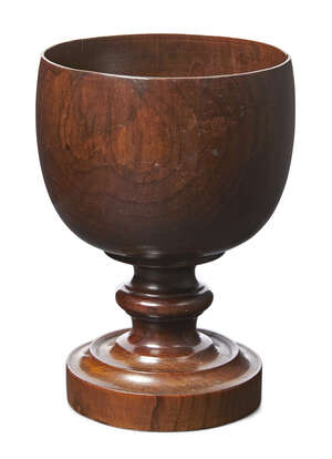 
	
		An English cedar goblet, late 18th century, the bowl raised on waisted stem and circular...
